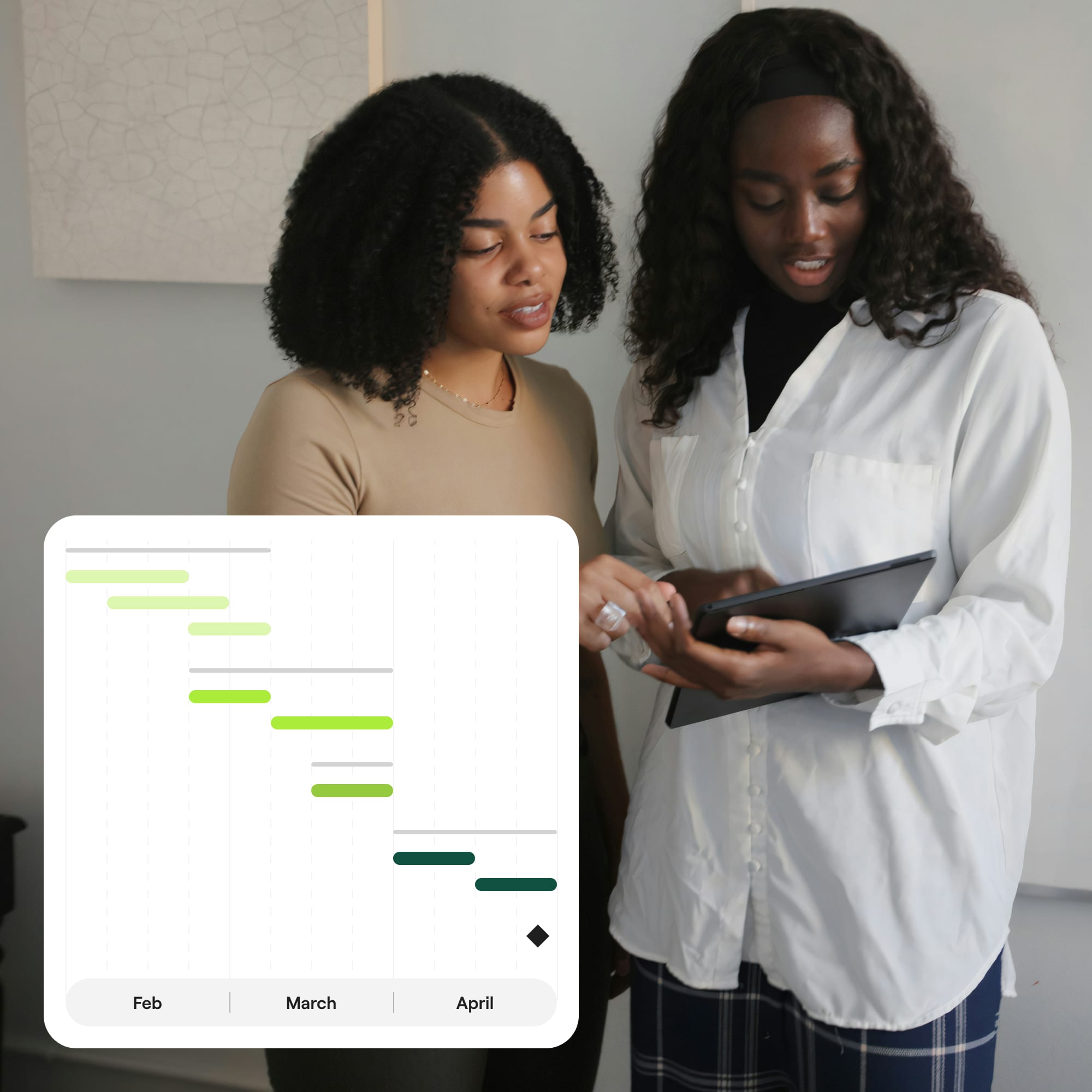 two people looking at tablet